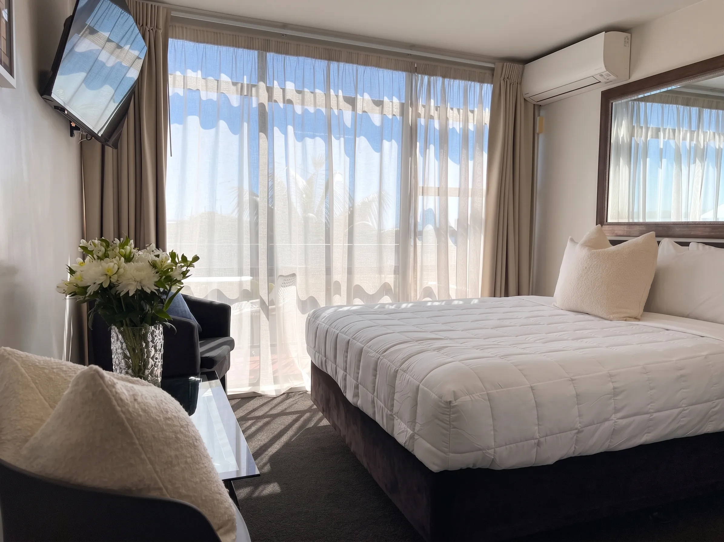 Queen Bed Small Studio at Bluewater Hotel, with a partial marina outlook
