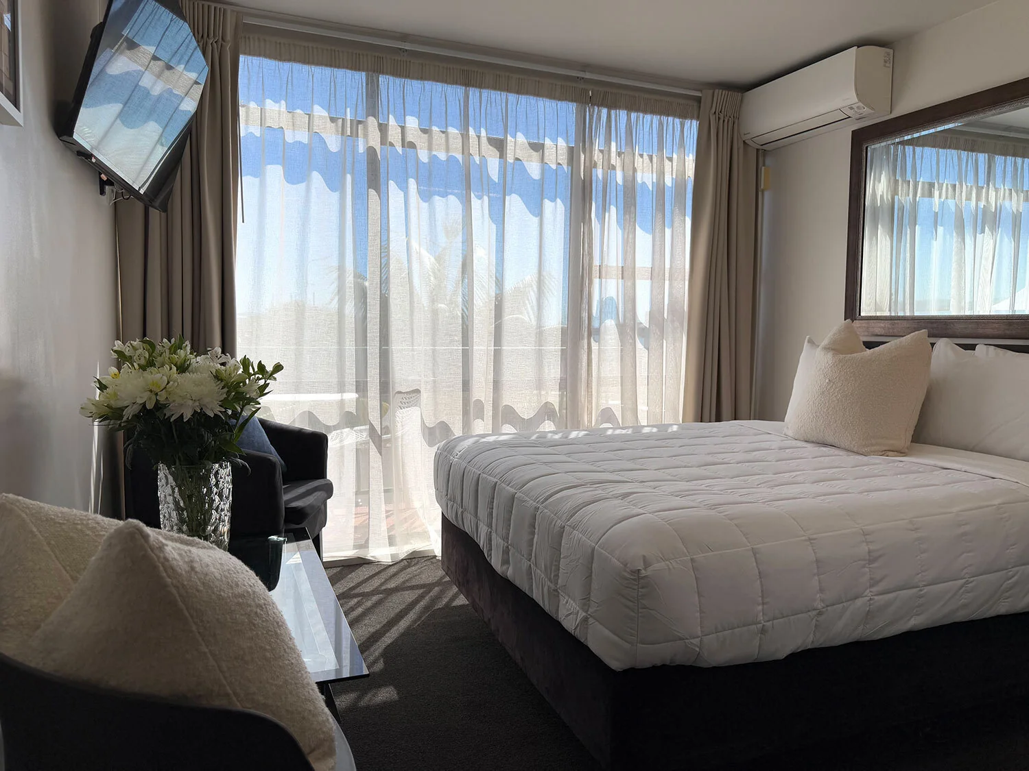 Queen Bed Small Studio — room at Bluewater Hotel