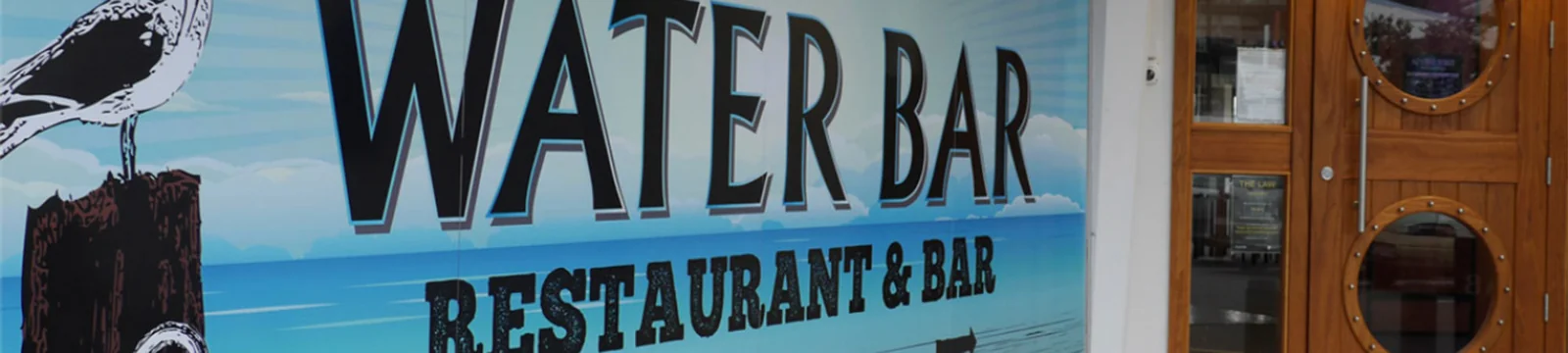 Water Bar restaurant at Bluewater Hotel — dining room looking towards the marina